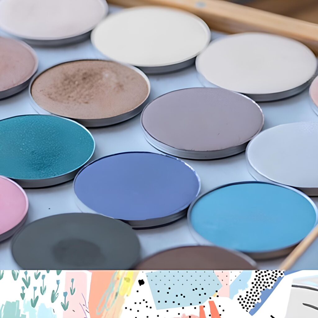 Palette de Maquillage : Fards à Paupières aux Tons Froids Palette de maquillage professionnelle avec fards à paupières ronds aux teintes bleues, grises et terreuses.